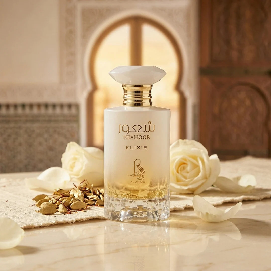 Al Absar Shahoor Elixir Eau de Parfum spray in a 100ml bottle with a velvet pouch, showcasing elegant packaging and perfume design.