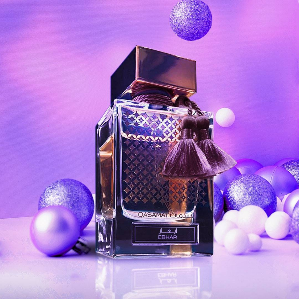 Rasasi Qasamat Ebhar EDP 65ML bottle with velvet pouch, showcasing elegant glass perfume bottle and luxurious packaging.