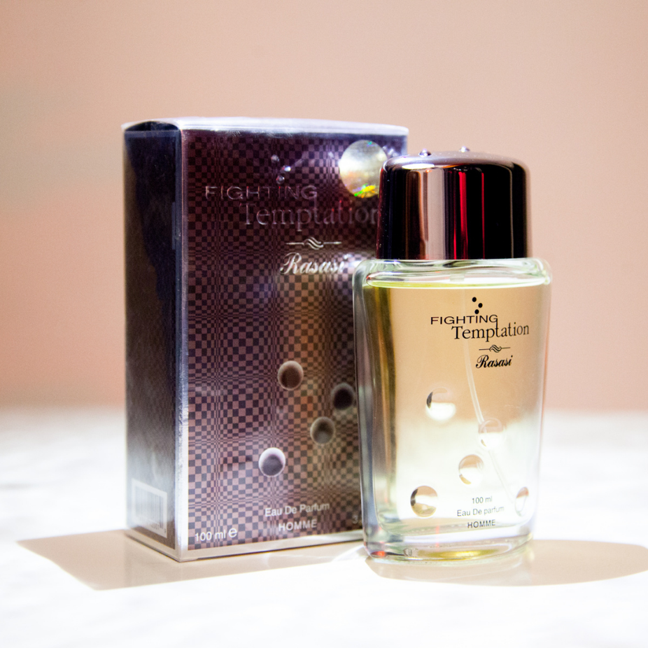 Rasasi Fighting Temptation EDP Eau De Parfum 100ML with velvet pouch, showcasing the perfume bottle and elegant packaging.