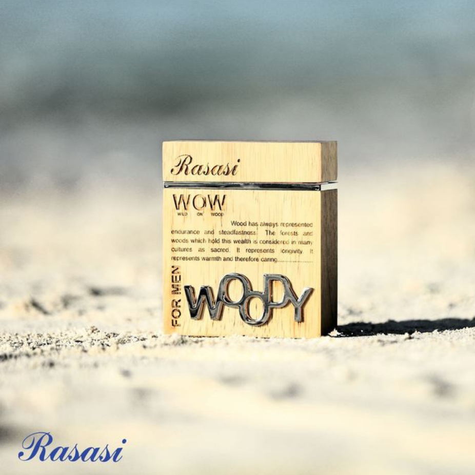 Rasasi Woody for Men EDP 60ML with velvet pouch, showcasing the elegant perfume bottle and luxurious red velvet pouch.