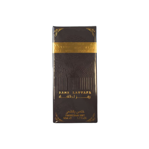 Lattafa Ramz Lattafa Gold Hair Mist 50ml bottle with elegant gold and white label, designed for refreshing and fragrant hair.