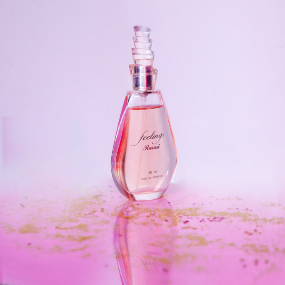 Rasasi Feelings for Women Eau De Parfum 60ml with pouch, elegant glass bottle with floral design and gold accents.