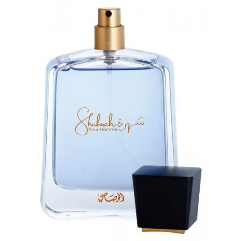 Rasasi Shuhrah Pour Homme EDP 90ML with velvet pouch, featuring sleek bottle and elegant packaging for men’s fragrance.