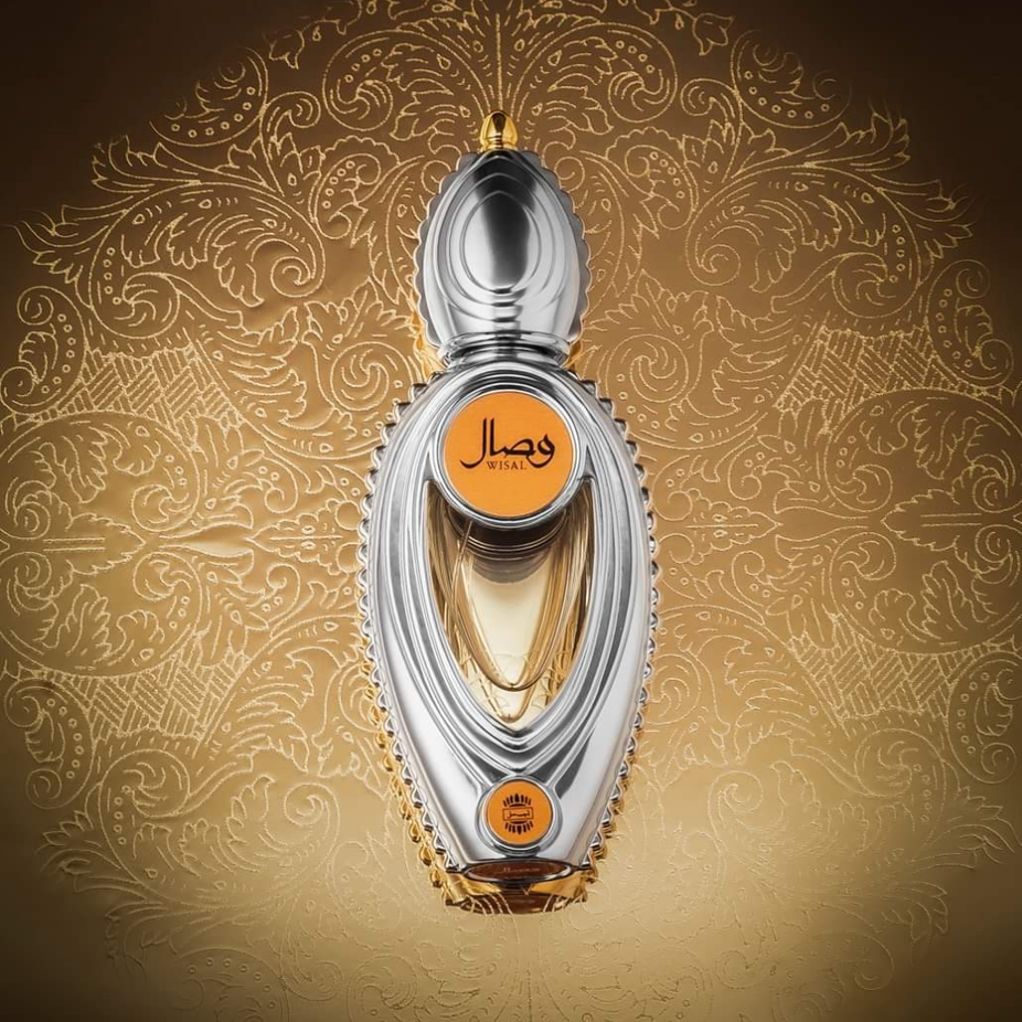 Wisal for Women EDP by Ajmal in a velvet pouch, 50ml bottle with elegant floral and fruity fragrance design.
