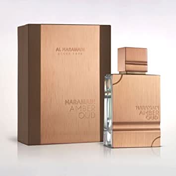 Al Haramain Amber Oud Eau De Parfum 60ml bottle with elegant packaging and amber-colored liquid display.