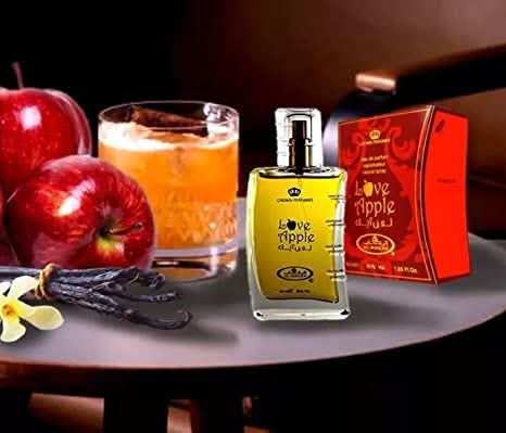 Al Rehab Love Apple Eau De Parfum 50ml bottle showing sleek glass design with pink and green apple-themed packaging.