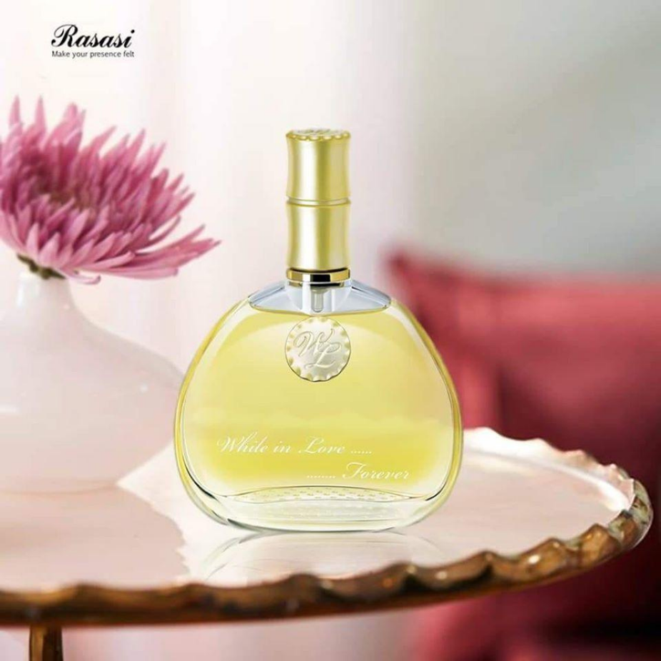 Rasasi While in Love Forever Women EDP 80ml with velvet pouch, showcasing the elegant perfume bottle and luxurious packaging.