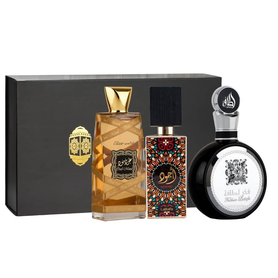 Lattafa Fakhar Men Ajwad & Oud Mood Elixir perfume gift set with magnetic box, featuring two 100ml bottles of men's fragrance.