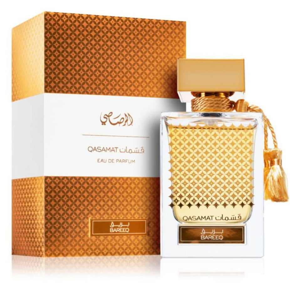Rasasi Qasamat Unisex EDP Eau De Parfum bundle, 65ml bottles, showcasing elegant perfume bottles in a luxurious setting.