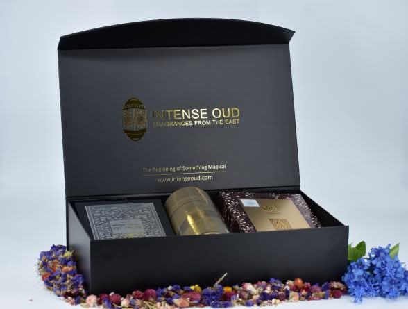 Lattafa Fakhar Men Ajwad & Oud Mood Elixir perfume gift set with 100ml bottles in a magnetic gift box, elegant presentation.