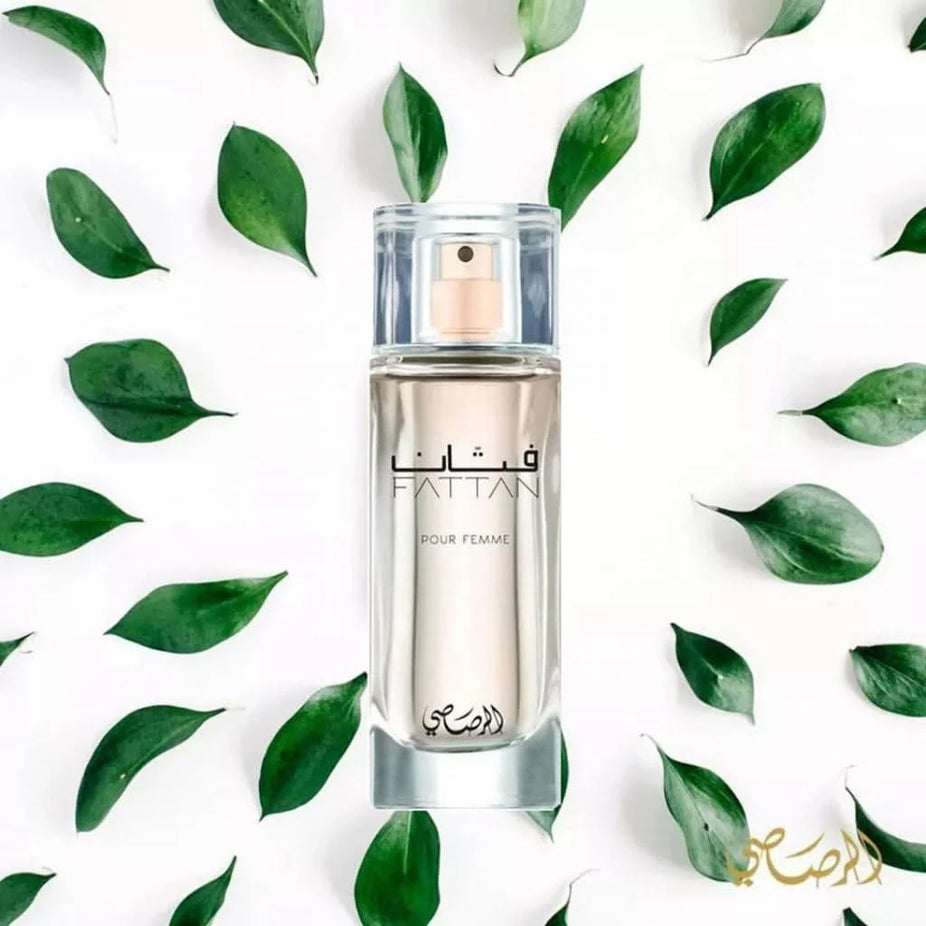 Rasasi Fattan for Women EDP 50ml perfume bottle in a luxurious velvet pouch, elegant floral scent for women.