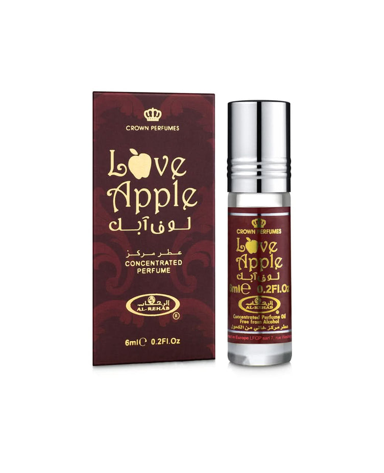 Love Apple concentrated perfume oil by Al-Rehab in a 6ml roll-on bottle, shown with its box, highlighting Arabic perfume packaging.