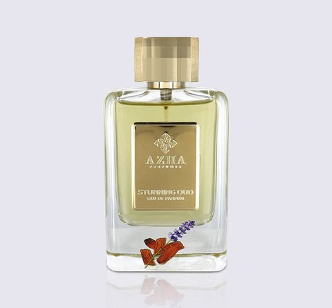Elegant 100ml Azha Stunning Oud Eau De Parfum bottle with intricate design and dark amber liquid inside.
