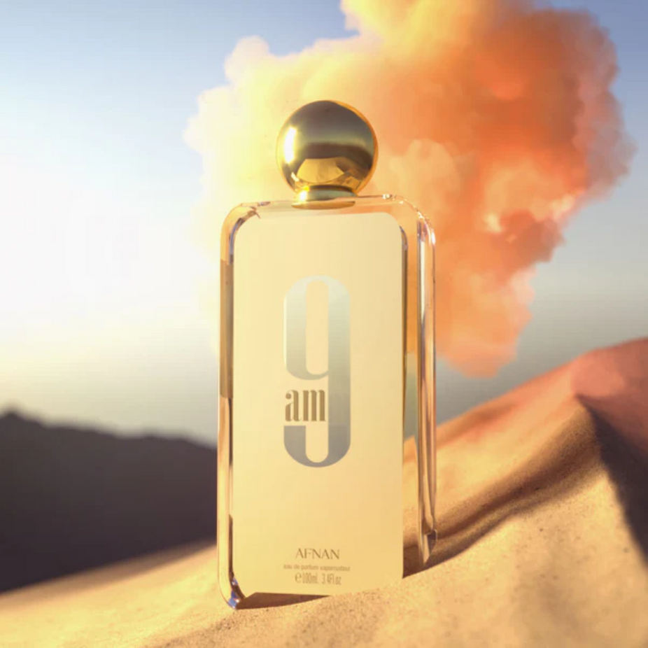 A 100ml bottle of Afnan 9AM Eau de Parfum Spray, with sleek design and clear branding, on a neutral background.