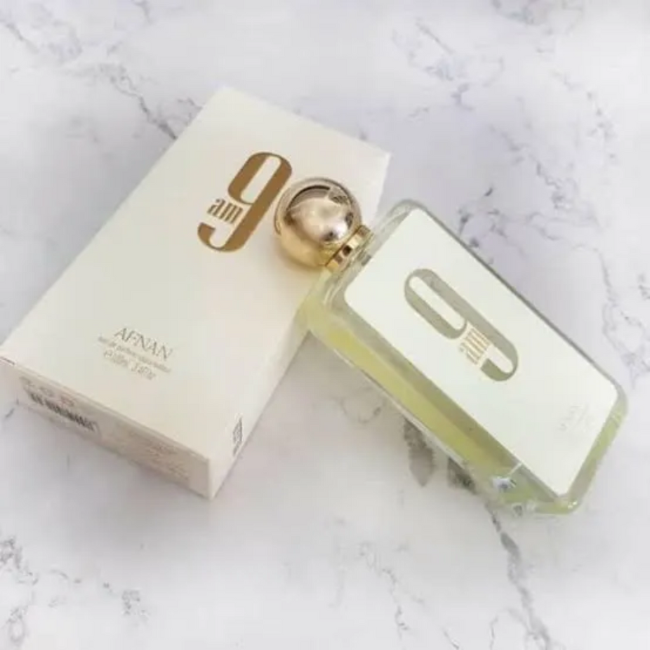 Afnan 9AM Eau de Parfum spray bottle, 100ml, sleek design, showcasing the fragrance container and cap.