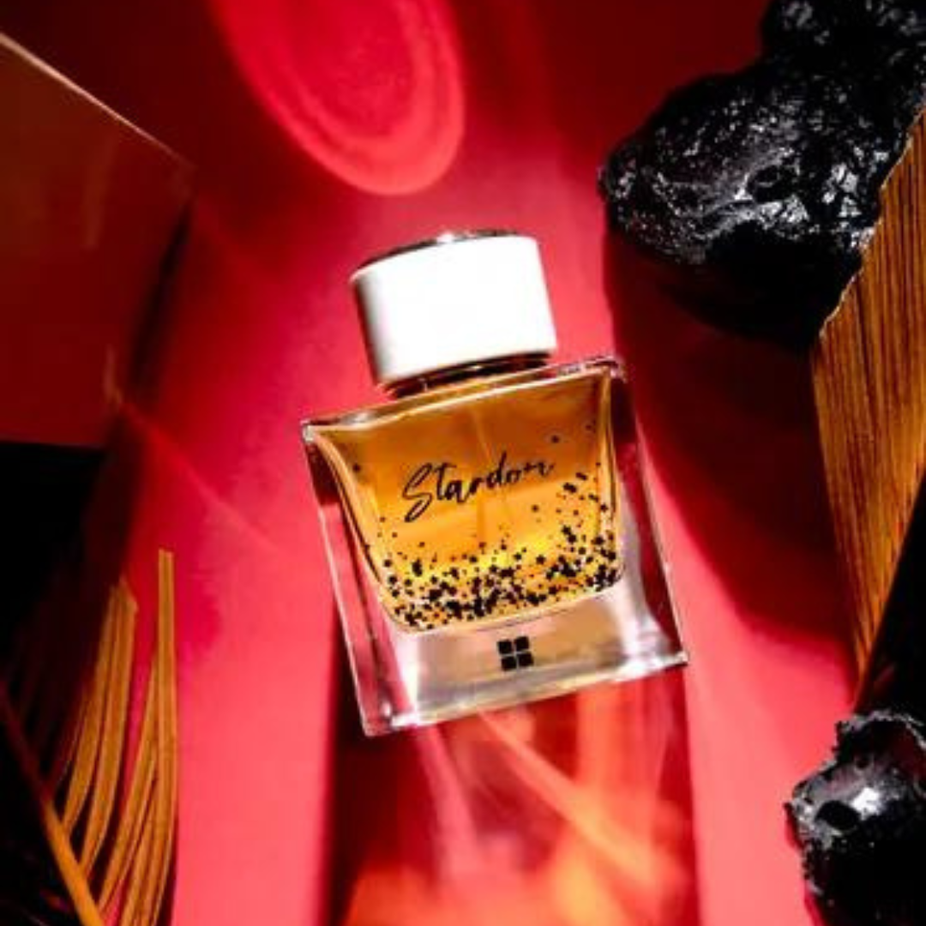 Ideas Stardom EDP for Women, 100ml bottle, elegant perfume bottle with floral accents, showcasing the Ideas brand perfume.