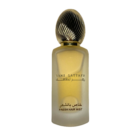 Lattafa Ramz Lattafa Gold Hair Mist 50ml bottle with elegant gold and white packaging, showcasing the luxurious hair mist product.