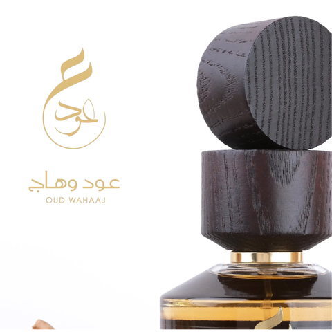Paris Corner Oud Wahaaj EDP 100ml bottle with elegant black cap and clear glass showcasing the rich, amber-colored perfume inside.