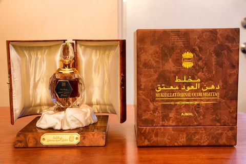 Ajmal Mukhallat Dahn Al Oudh Moattaq CPO concentrated perfume oil in an 18ml bottle with box, featuring rich oud fragrance