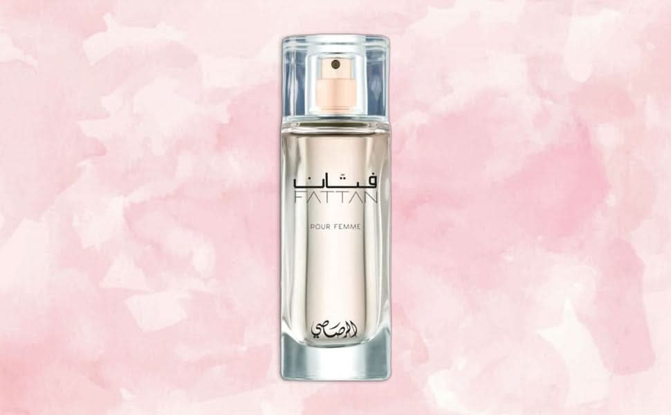 Rasasi Fattan for Women EDP 50ML in a velvet pouch, elegant glass bottle with floral and woody fragrance notes.